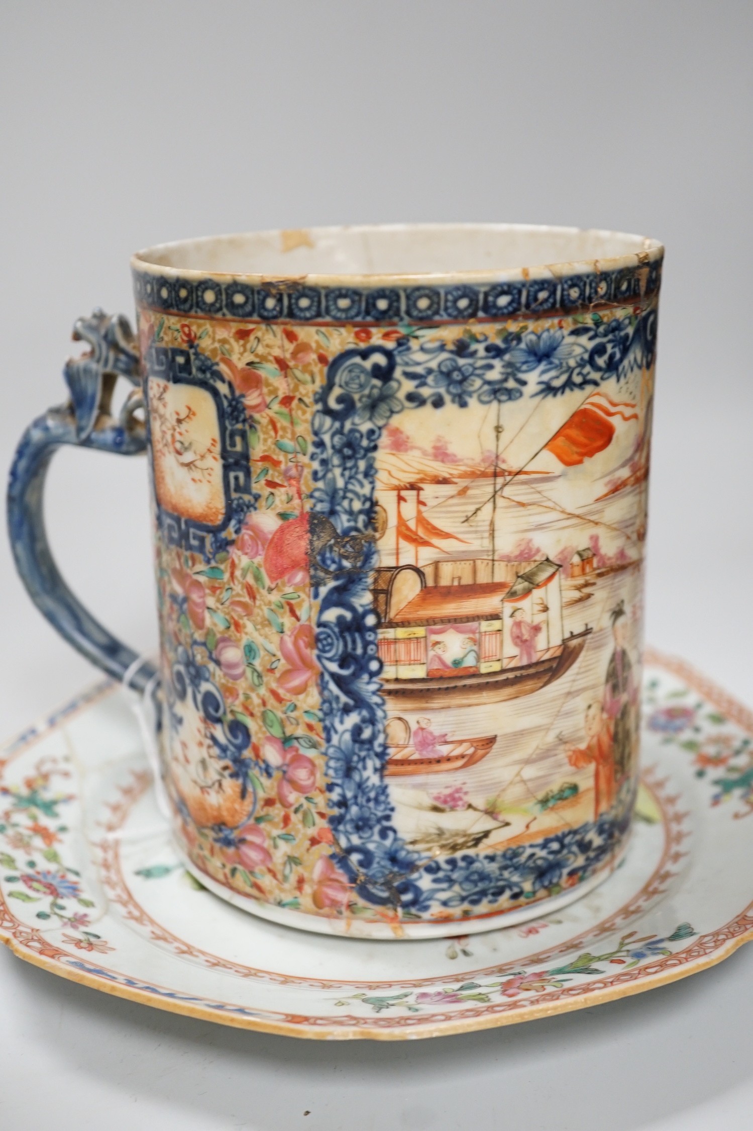 A Chinese figure of blanc de chine, a dragon tea bowl, a saucer, a large tankard, and another Chinese dish, tallest 23cm